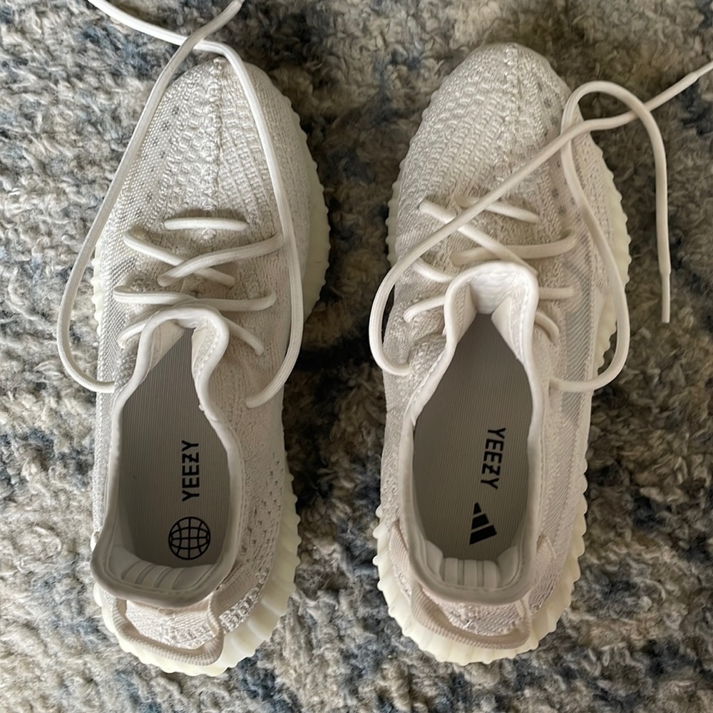 Size 8.5 men’s white Yeezy worn twice.